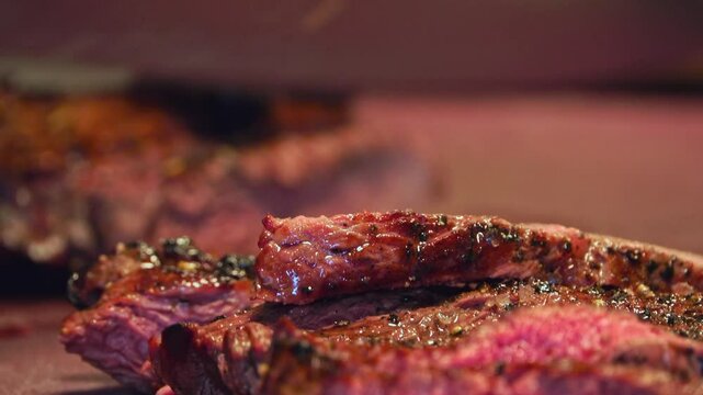 Experience the mouthwatering sizzle of a juicy beef steak on the grill in this up-close video. Watch as the meat sears to perfection, locking in rich flavors and creating that perfect crust. The inten