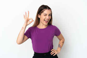 Obraz premium Young caucasian woman isolated on white background showing ok sign with fingers