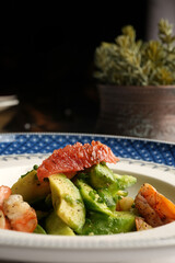 Healthy seafood salad with shrimps, avocado and grapefruit