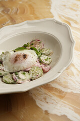 Healthy breakfast salad with fried eggs omelette and vegetables