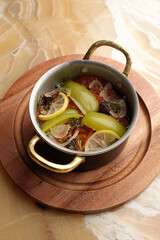 Baked vegetables in cooking pan with bell pepper, tomatoes, onions and herbs