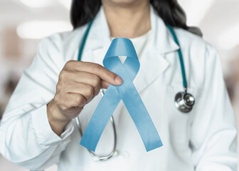 Light blue ribbon for prostate cancer awareness in November's month, men's health care,...