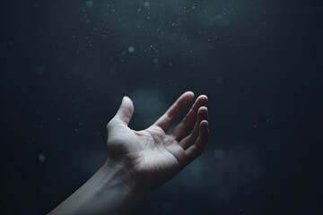 Fototapeta premium A hand reaches upward through dark water, symbolizing a struggle for air and hope amidst the depths.
