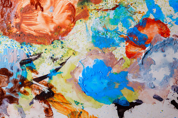 Colorful abstract texture. Smears of oil paint on an art palette. The concept of the modern school of art. Fragment of creative work. Colors of the year 2025