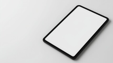 A sleek, blank tablet lies on a smooth surface, emphasizing minimalism and modern design.