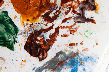 Colorful abstract texture. Smears of oil paint on an art palette. The concept of the modern school...