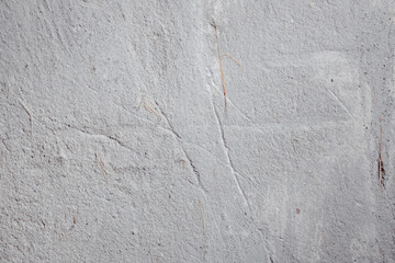 Plastered beige surface with cement material. Textured pattern with space for text. Texture of old gray concrete wall for background. Calm neutral spa background. 