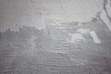 Plastered beige surface with cement material. Textured pattern with space for text. Texture of old gray concrete wall for background. Calm neutral spa background. 