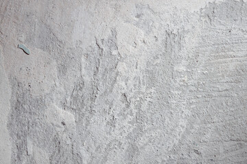 Plastered beige surface with cement material. Textured pattern with space for text. Texture of old gray concrete wall for background. Calm neutral spa background. 