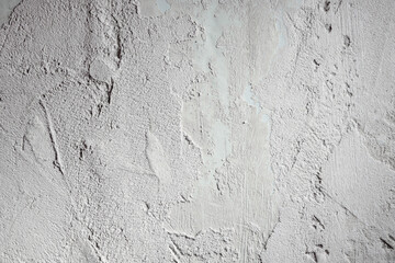 Plastered beige surface with cement material. Textured pattern with space for text. Texture of old gray concrete wall for background. Calm neutral spa background. 