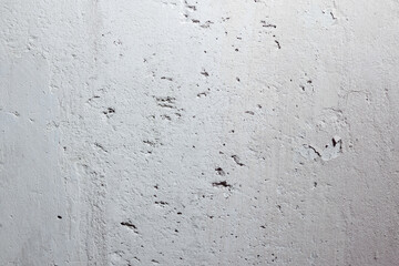Plastered beige surface with cement material. Textured pattern with space for text. Texture of old gray concrete wall for background. Calm neutral spa background. 