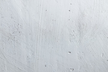 Plastered beige surface with cement material. Textured pattern with space for text. Texture of old gray concrete wall for background. Calm neutral spa background. 