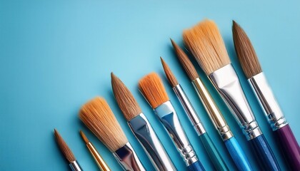 Set of Round Tip Artist Paint Brushes with Wooden Handles on Light Blue Background. Perfect for Fine Detailing, Blending, and Layering in Watercolor, Acrylic, and Oil Painting Techniques for Beginners