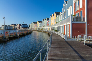 Naklejka premium Modern Multi Colored houses in Houten, the Netherlands. Morning blue sky.