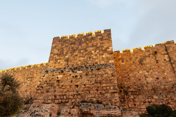 Section of the ramparts and walls of the Old City of Jerusalem, illuminated by decorative lights on Mt. Zion. © Yehoshua Halevi