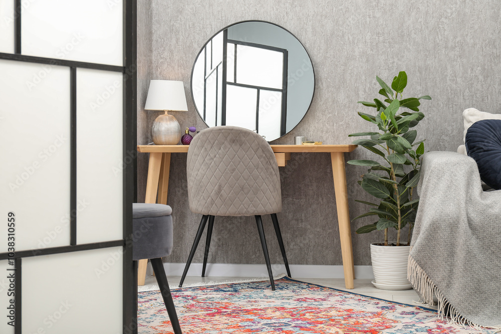 Sticker Mirror, dressing table, chair, houseplant and folding screen indoors. Interior design