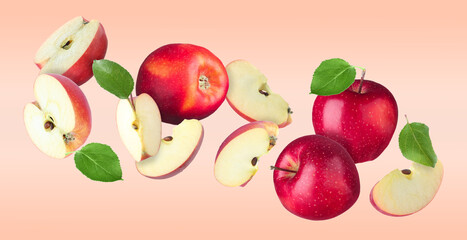 Fresh red apples in air on pink beige background