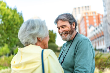 Senior lovers standing in the city park