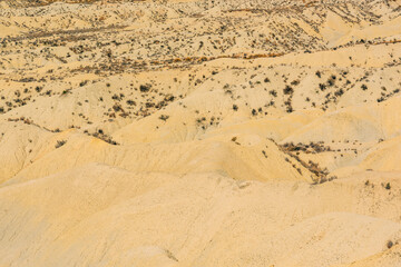 Arid mountainous desolate landscape on a sunny day.