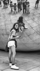 Chicago, IL - July 24, 2024: Tourists and locals reflections at Cloud Gate, a major city attraction