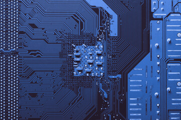 Old desktop motherboard. Chips and electronic components close-up. Can be used as a poster or background for design.