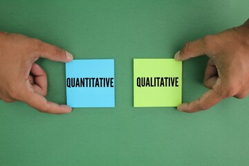 colored paper with the words quantitative and qualitative. two fundamental approaches to research...