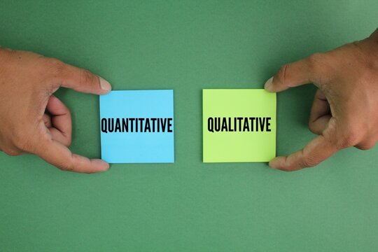 colored paper with the words quantitative and qualitative. two fundamental approaches to research and data analysis