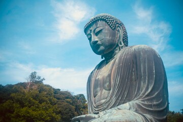 The Great Buddha Statue "Daibutsu" a symbol at Kotokuin Temple. Landmark and popular destination for tourists. [October 10, 2024 Kamakura, Japan]