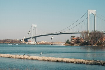 A bridge spans a river with a view of the water below