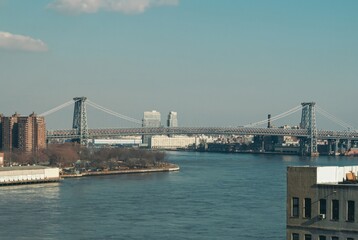 A bridge spans a river in a city