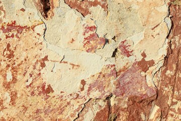 A fragment of a wall with red tints and yellow tint in the style of the 90s. Severe scratches and surface damage.