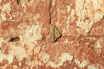 A fragment of a wall with red tints and yellow tint in the style of the 90s. Severe scratches and surface damage.