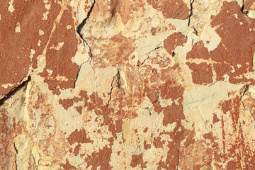 A fragment of a wall with red tints and yellow tint in the style of the 90s. Severe scratches and surface damage.