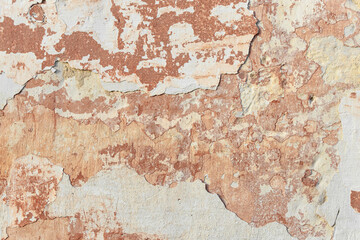 Fototapeta premium A fragment of a wall with red tints and yellow tint in the style of the 90s. Severe scratches and surface damage.