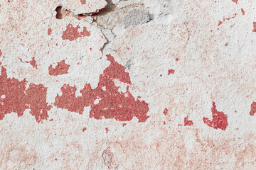 Grunge red concrete background. Textured plaster wall. Color of the year 2025 concept. Top view, layout for design. Surface with peeling shabby pattern.