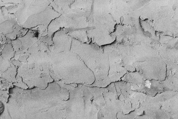 Grey concrete wall with natural defects. Fragment of the cement surface with natural texture. Universal background for conceptual advertising. Textured background for integration into the design.