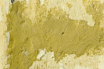 Fototapeta premium Grunge yellow concrete background. Textured plaster wall. Color of the year 2025 concept. Top view, layout for design. Surface with peeling shabby pattern.