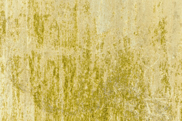 Grunge yellow concrete background. Textured plaster wall. Color of the year 2025 concept. Top view, layout for design. Surface with peeling shabby pattern.