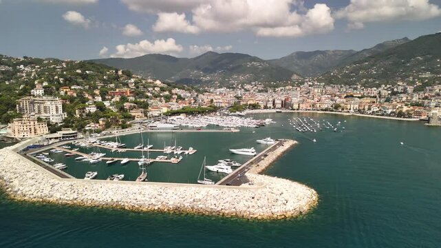 Stunning aerial view of Rapallo's picturesque harbor and coastal beauty under sunny skies