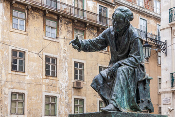 Fototapeta premium Statue of O Chiado, the Satirical Poet Antonio Ribeiro in Lisbon, Portugal