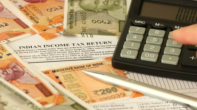 Indian Income Tax Return. Financial Concept. Tax Form. Indian Rupees and Tax Calculation on Calculator. Close up