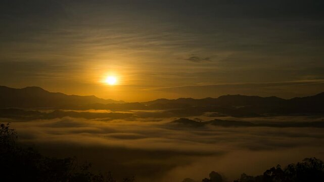 First light in sunrise morning rolling sea of clouds in the mountain, beautifull sky background, time-lapse