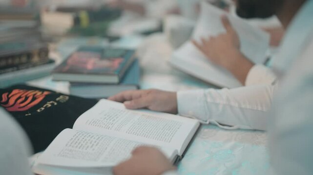 Jewish books reading turning pages of Torah