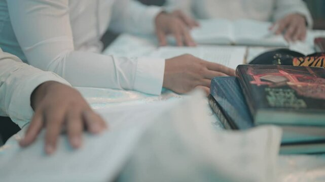 Jewish books reading turning pages of Torah