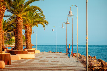 Famous waterfront with woman while walking her dog