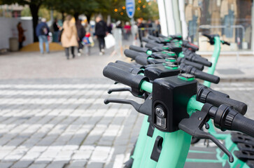 Electric Scooters Parked in a Row