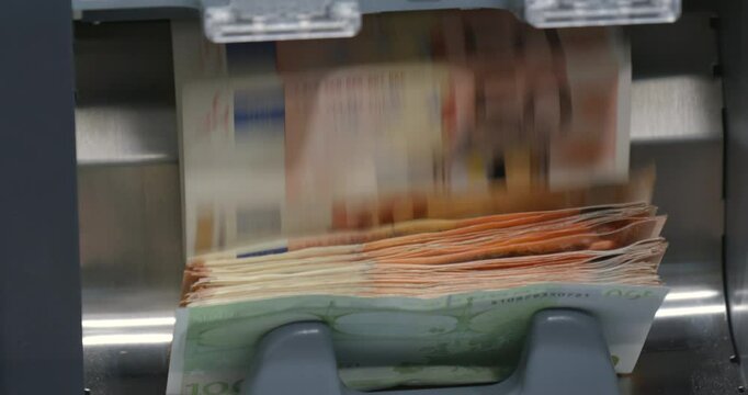 defocus, сash money euros into banknote counter. High quality video 6k 4:2:2 10bit downscale 4k 