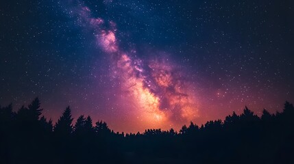 Fototapeta premium Night sky featuring the vibrant Milky Way galaxy and pine forest silhouette, starry cosmos with colorful nebula, creating a mystical atmosphere in high-resolution astrophotography.