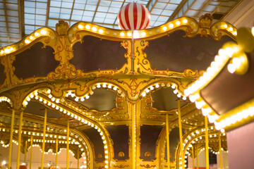 Obraz premium Carousel with Colorful Horses at a Fairground