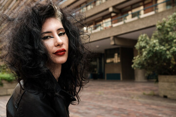 Head-shot of alternative young woman made with a wide angle lens.